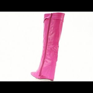 Brand new -wedge heel boots. Never worn.